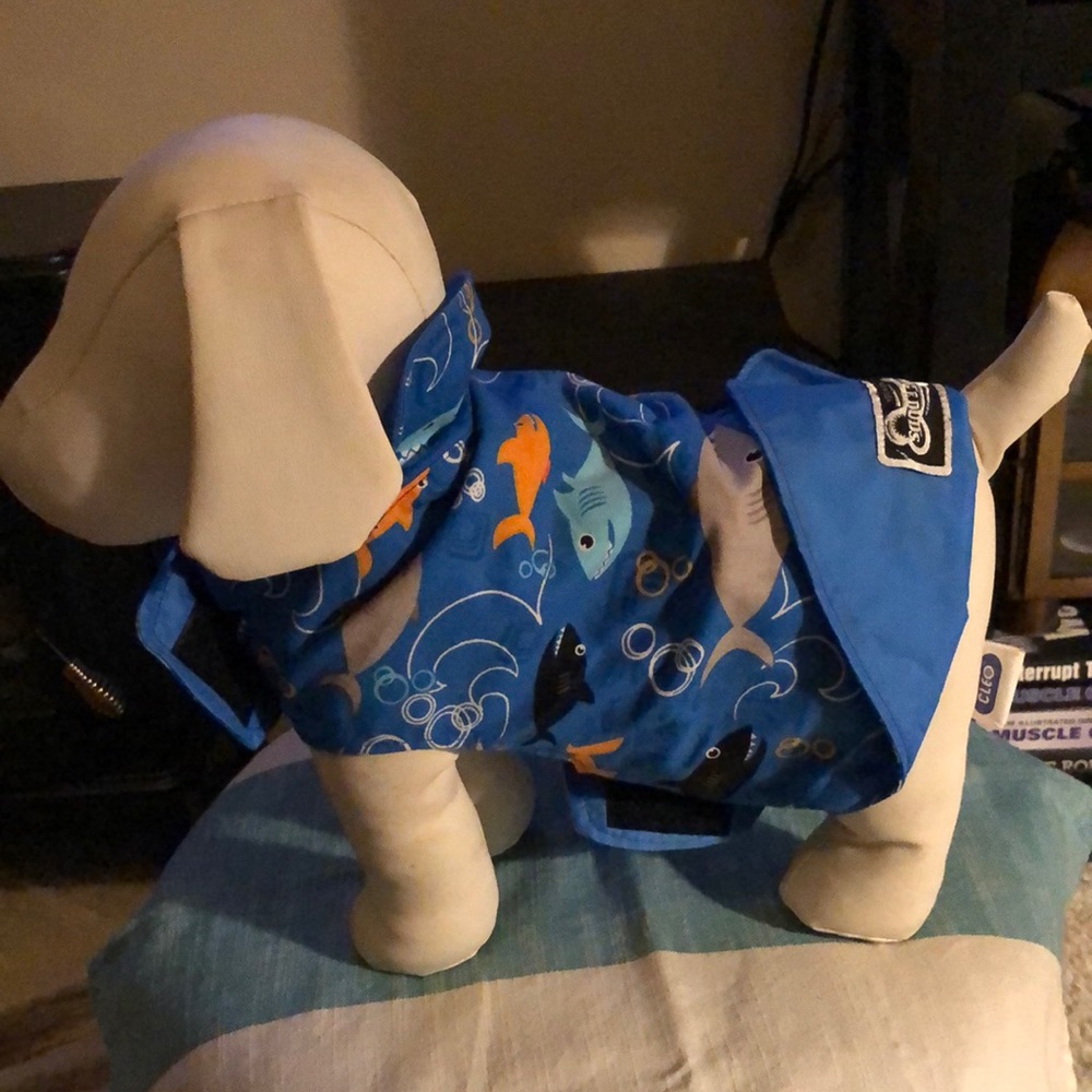 Dog appareal water resistant nylon material.. Reversible with cotton.Fish